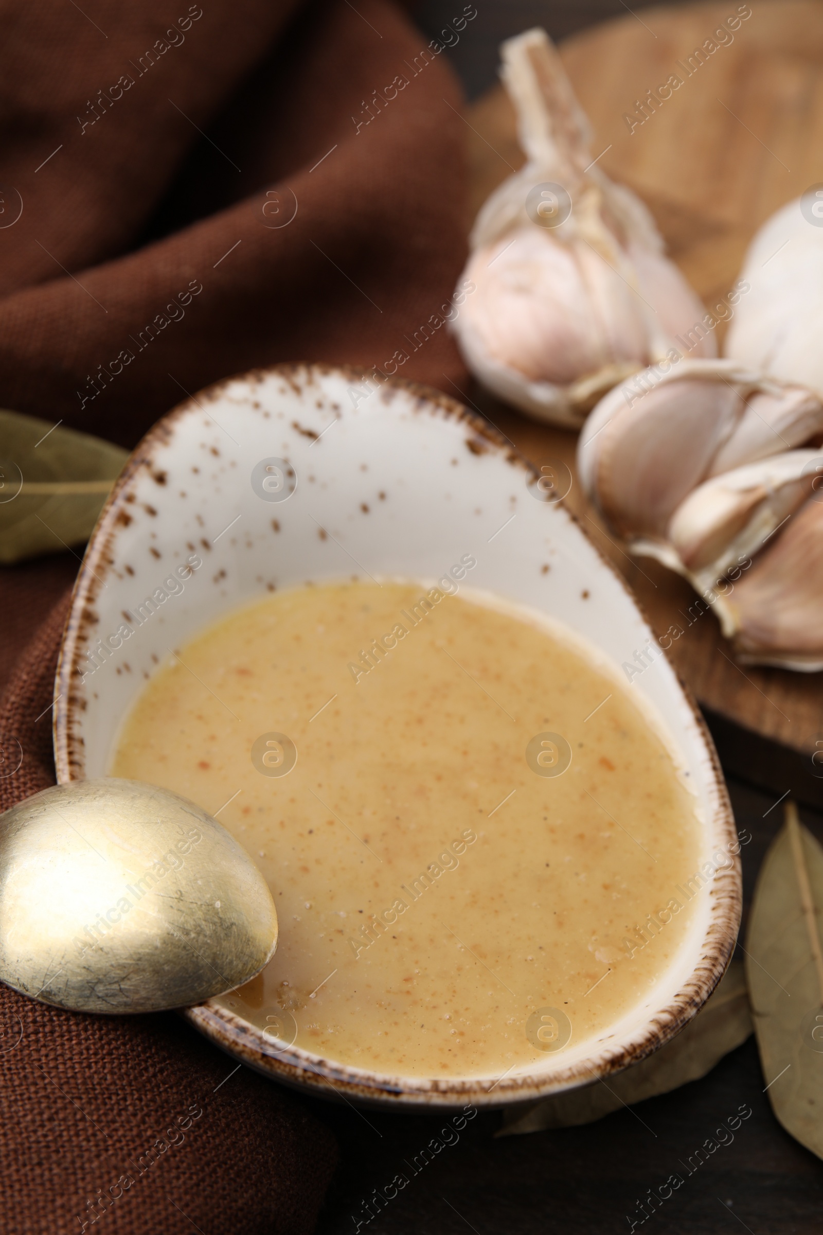 Photo of Delicious turkey gravy served on table, closeup