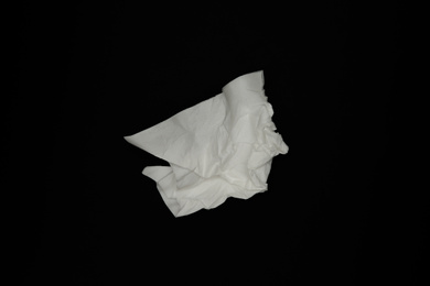 Photo of Used white paper tissue on black background