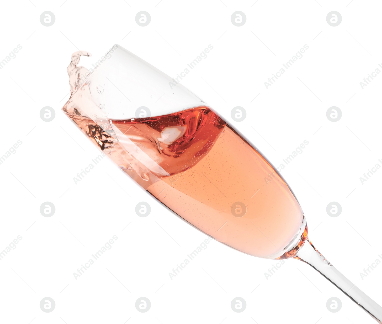 Photo of Glass of rose champagne isolated on white