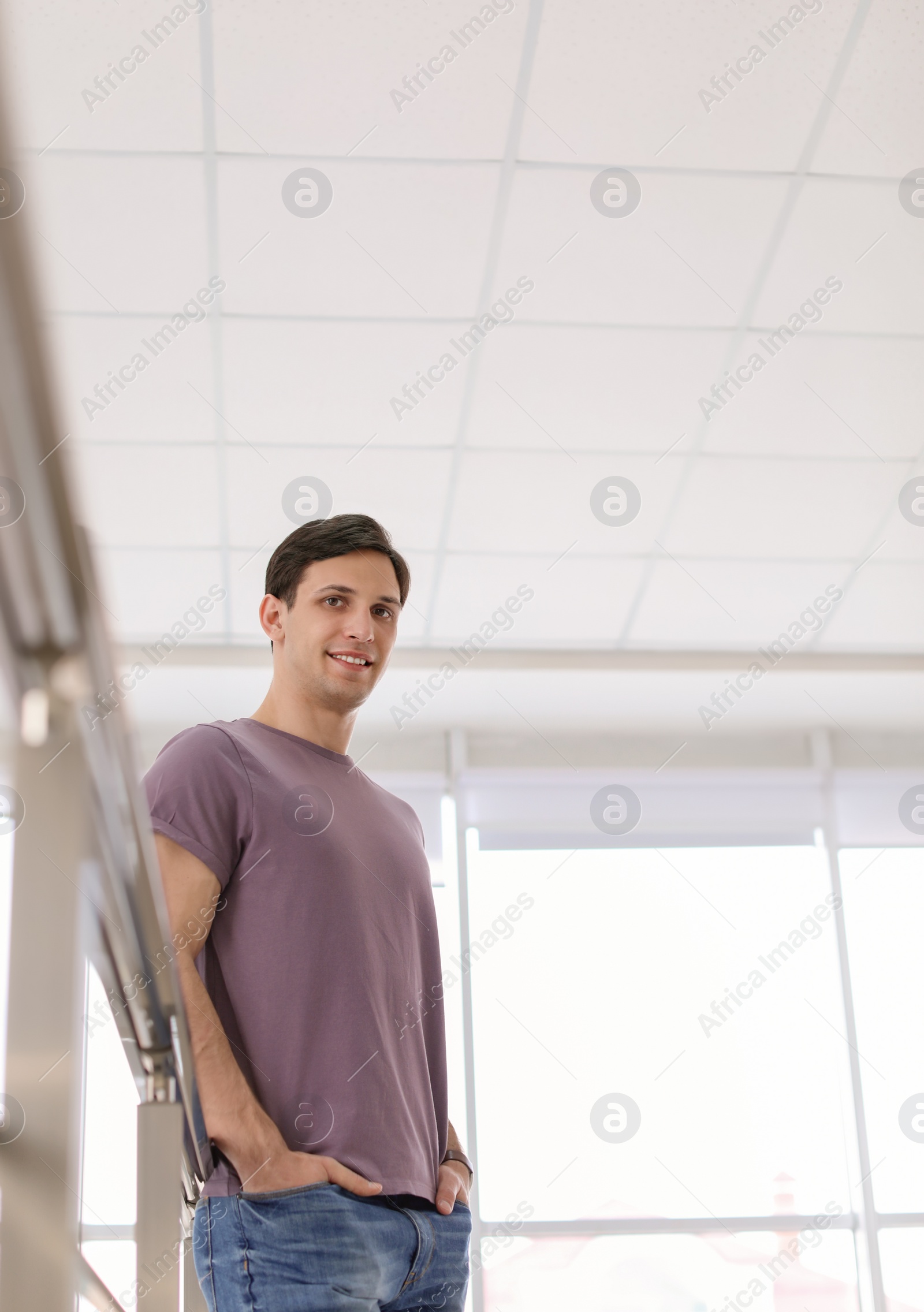 Photo of Portrait of confident young man, indoors