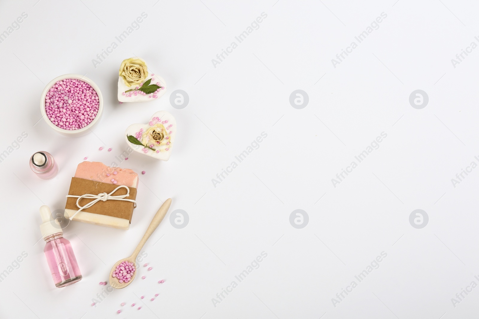Photo of Natural handmade soap and ingredients on white background, top view