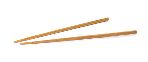 Photo of Chopsticks made of bamboo on white background