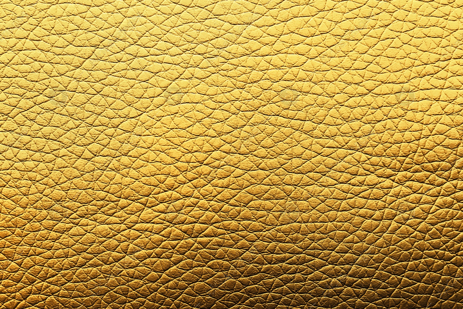 Image of Golden textured surface as background, closeup view