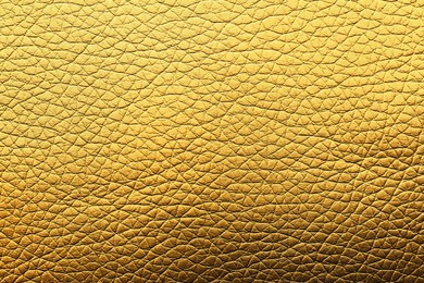 Image of Golden textured surface as background, closeup view