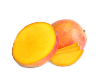 Photo of Delicious whole and cut mangoes on white background