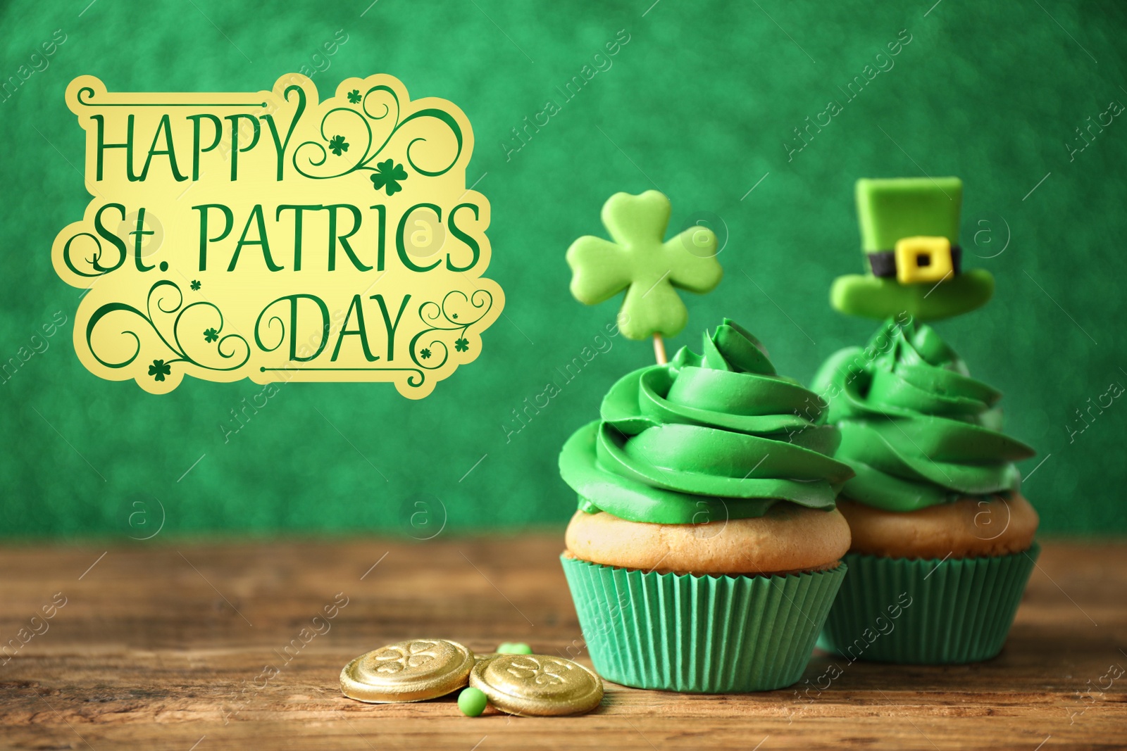 Image of Decorated cupcakes and coins on wooden table. St. Patrick's Day celebration