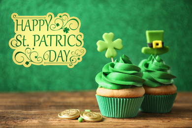 Image of Decorated cupcakes and coins on wooden table. St. Patrick's Day celebration