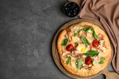 Delicious homemade pita pizza and olives on grey table, flat lay. Space for text