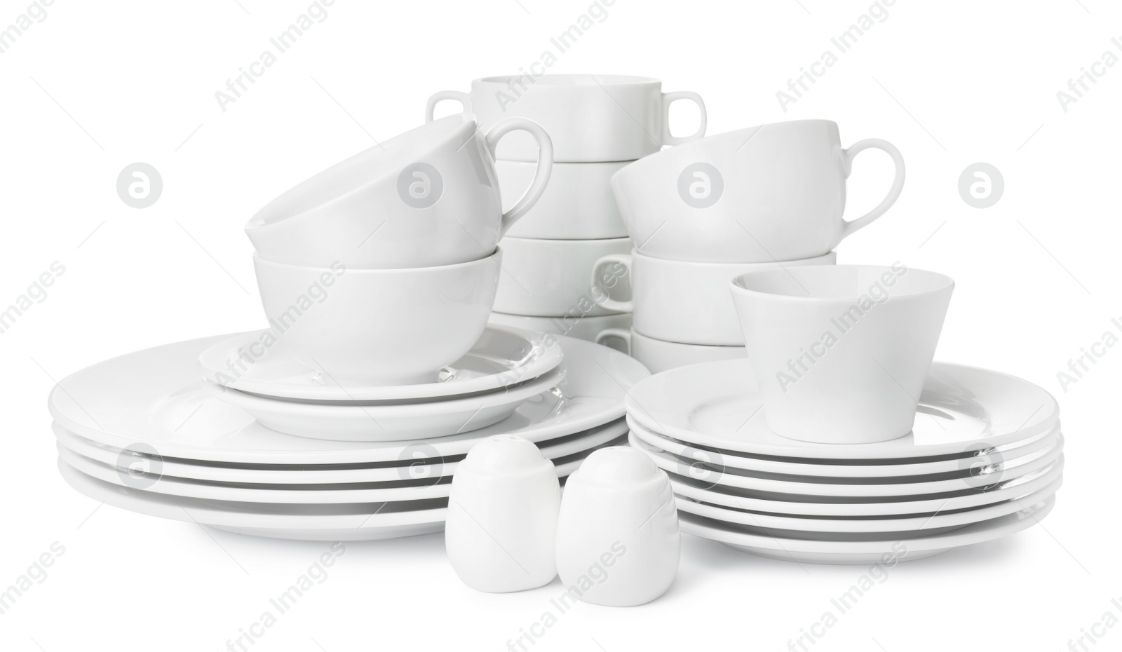 Photo of Set of clean dishware isolated on white