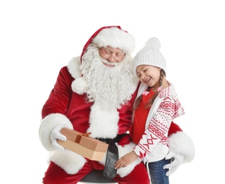 Authentic Santa Claus with gift box and little girl on white background