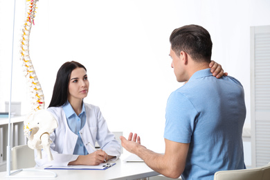 Man visiting professional orthopedist in medical office
