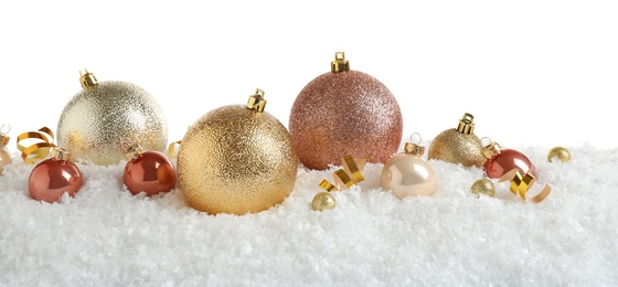 Christmas tree decoration on artificial snow against white background