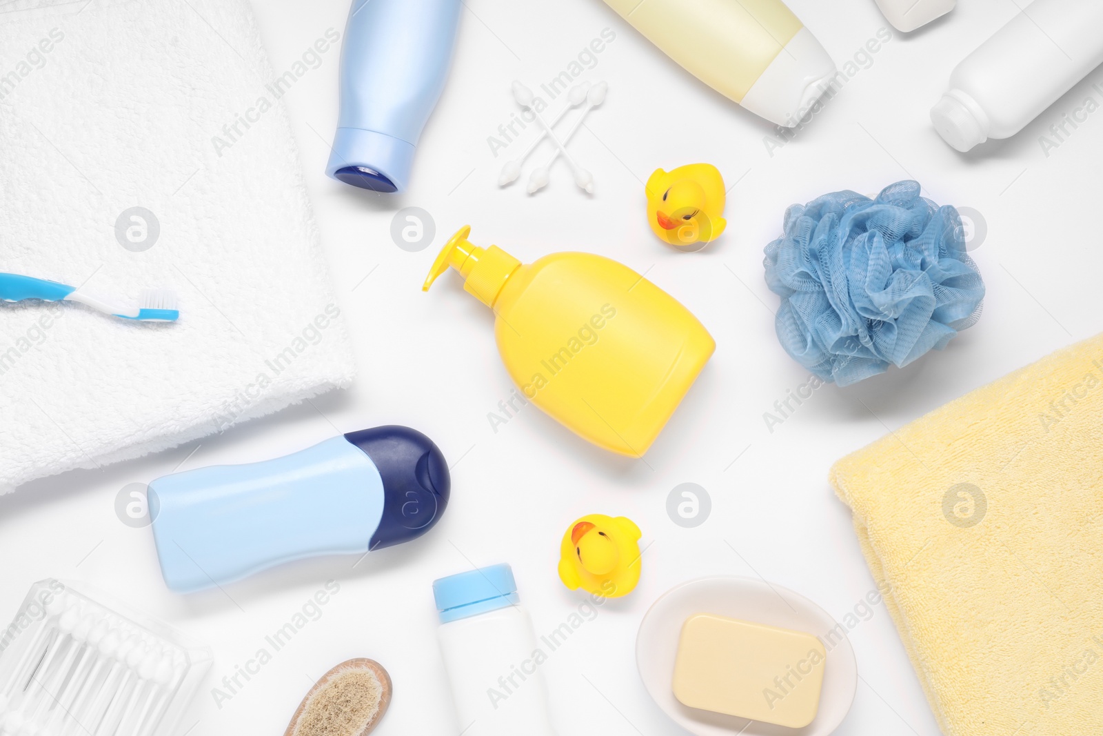 Photo of Different baby bath accessories and cosmetic products on white background, flat lay