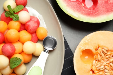 Flat lay composition with melon and watermelon balls on table
