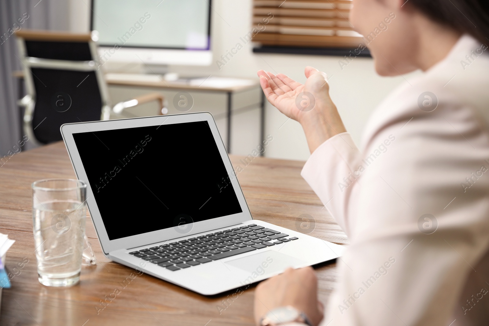 Photo of Woman using video chat on laptop in home office, closeup. Space for text