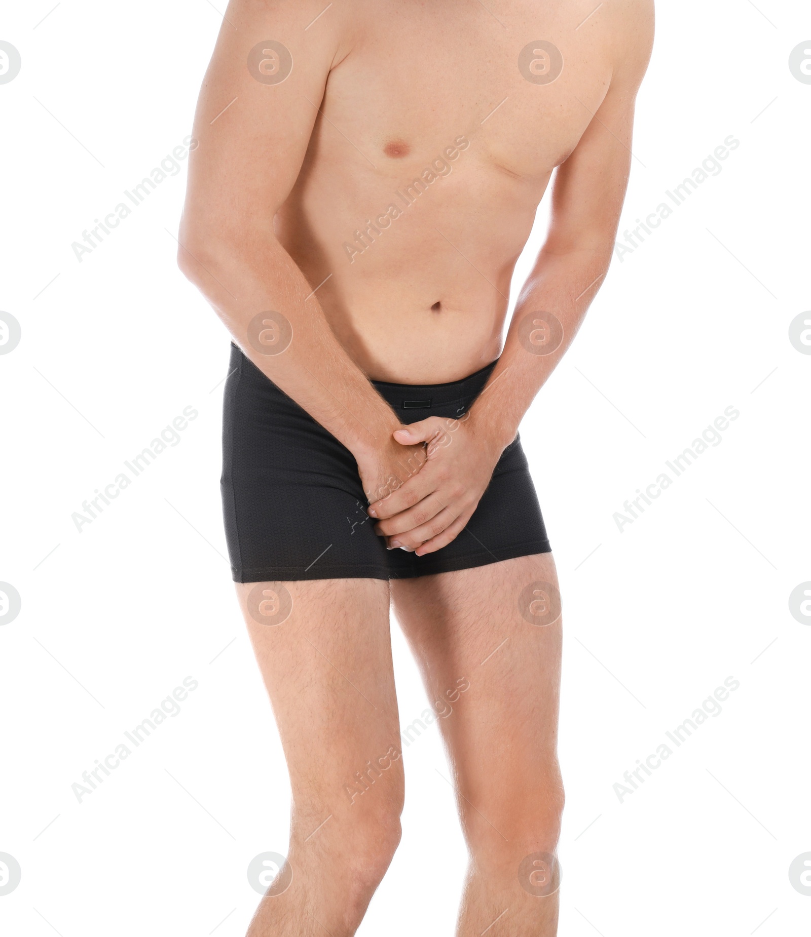 Photo of Man suffering from pain on white background, closeup. Urology problems