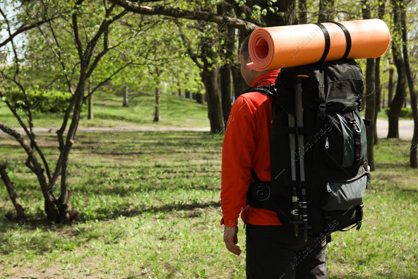 Photo of Hiker with backpack ready for journey in park