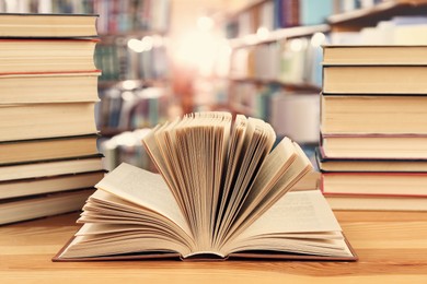 Image of Many books on wooden table in library