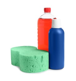 Photo of Bottles and car wash sponge on white background