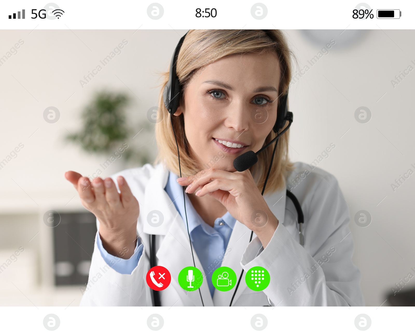 Image of Online medical consultation. Doctor with headset working via video chat application