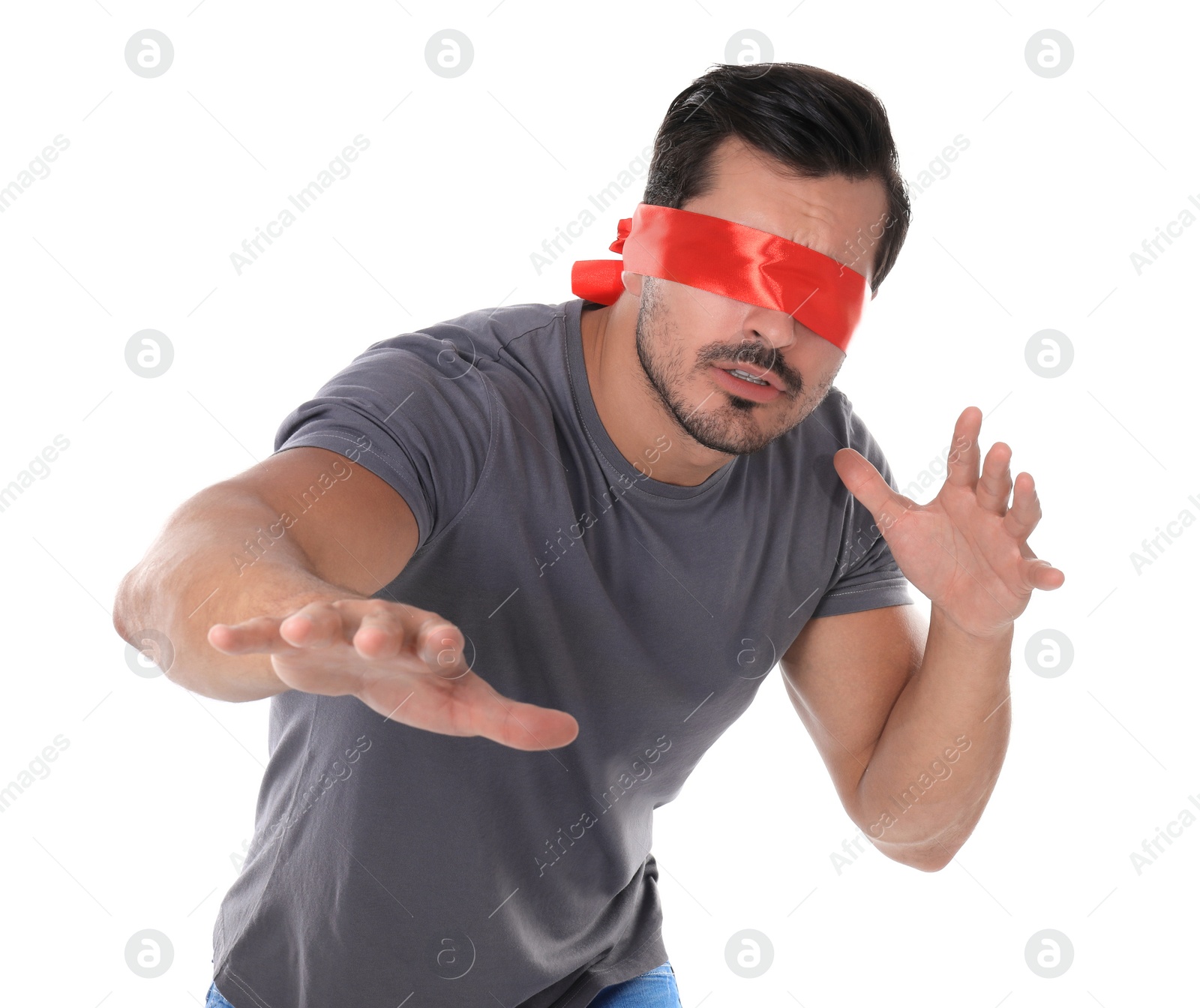 Photo of Young man wearing red blindfold on white background