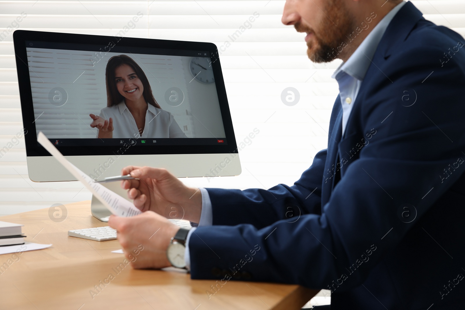 Photo of Human resources manager conducting online job interview via video chat on computer, closeup