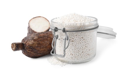 Tapioca pearls in jar and cassava roots isolated on white