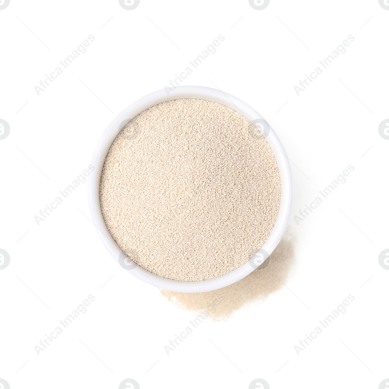 Photo of Granulated yeast in bowl on white background, top view