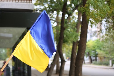 Photo of National flag of Ukraine on city street