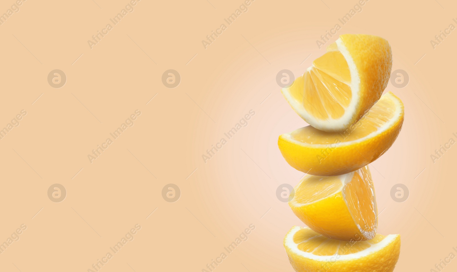 Image of Stack of cut fresh lemons on pale coral background, space for text