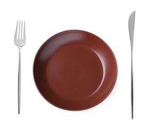 Image of Empty brown plate with fork and knife on white background, top view