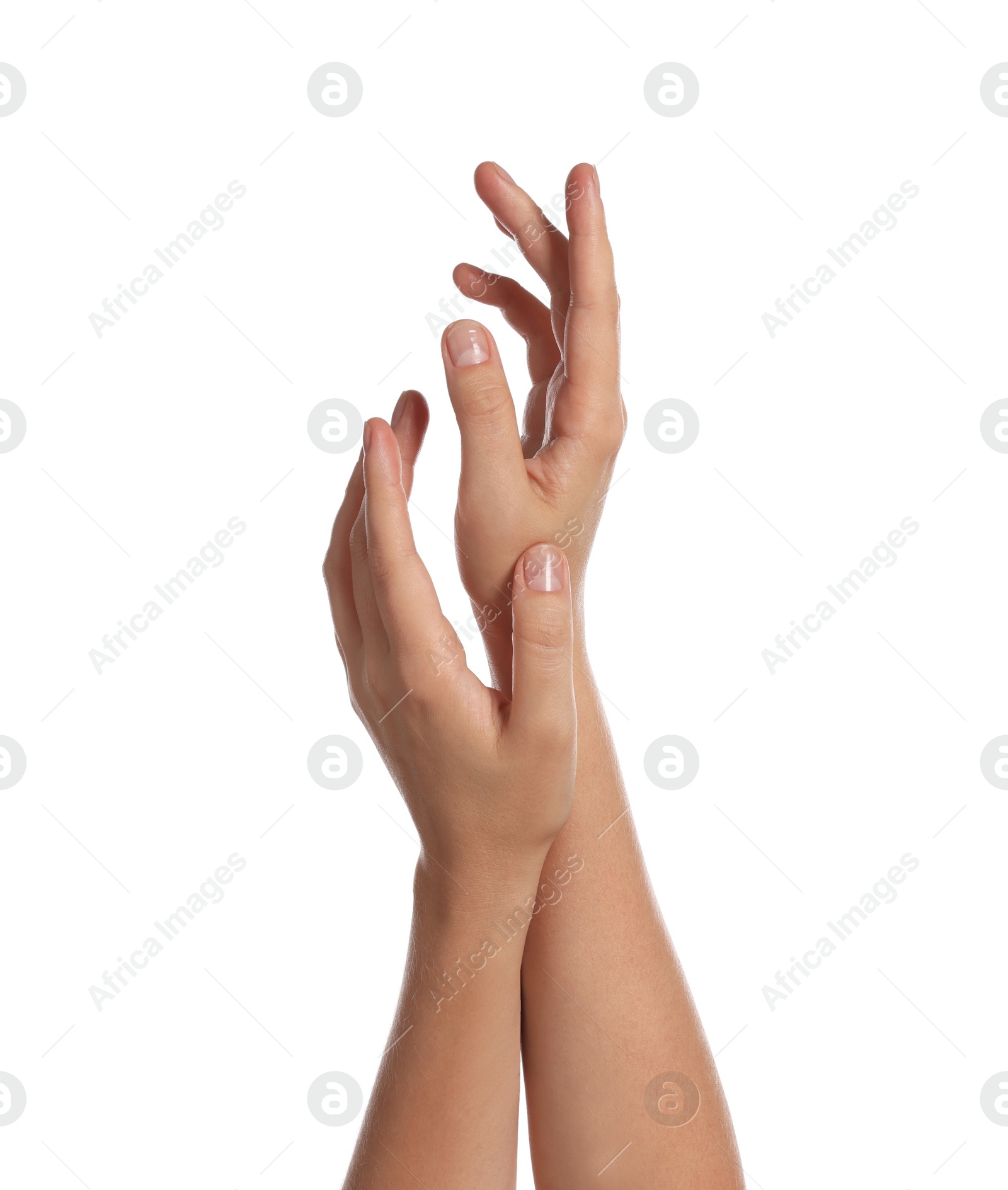 Photo of Woman applying cream on her hand against white background, closeup