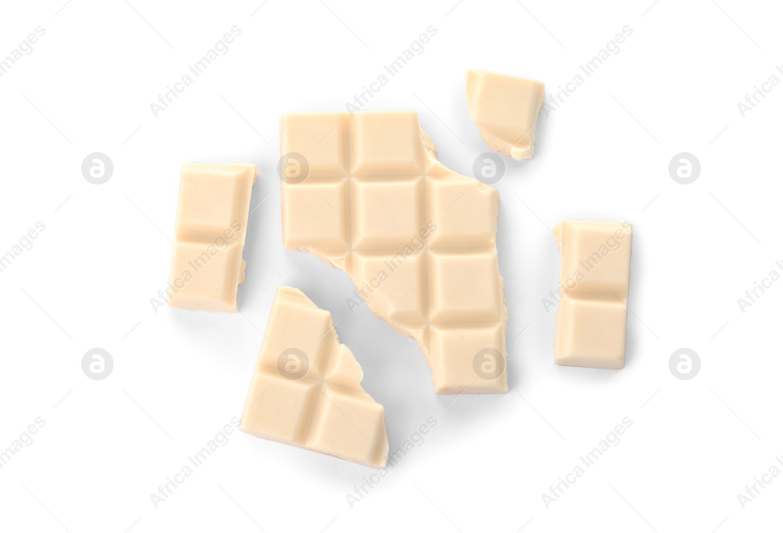 Photo of Delicious chocolate pieces on white background, top view