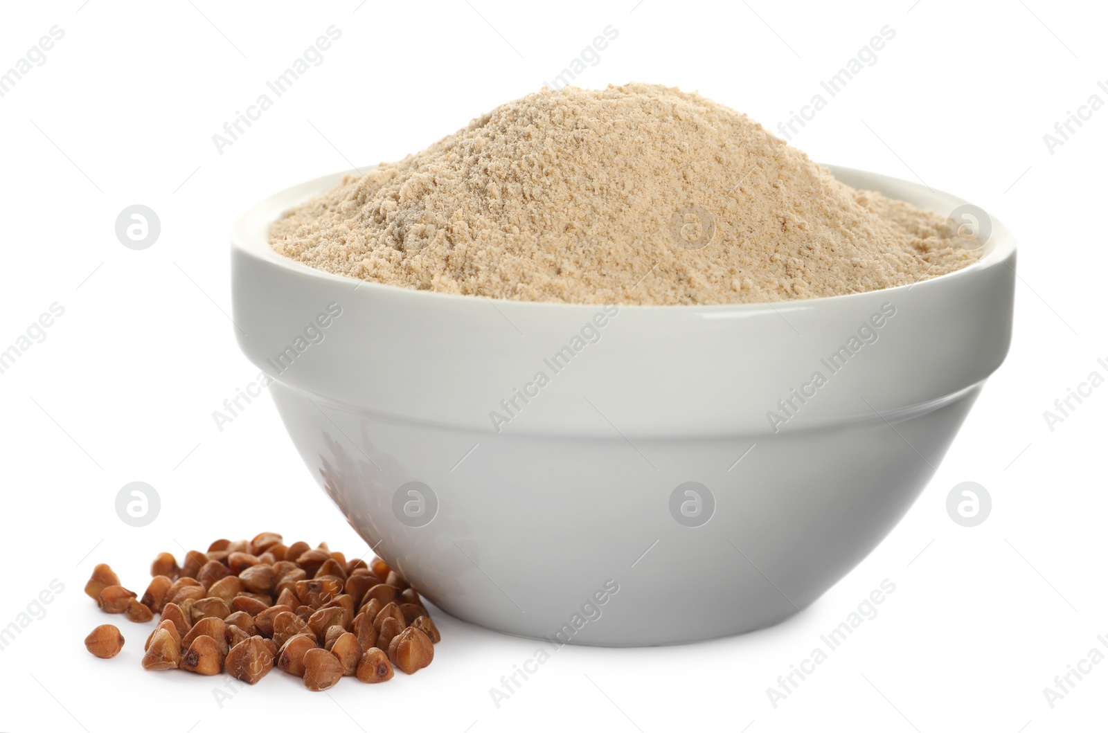 Photo of Bowl of buckwheat flour on white background