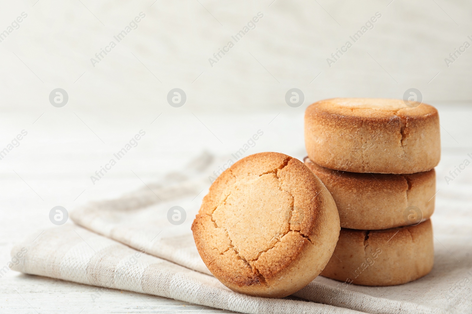 Photo of Sweet delicious butter cookies on white table