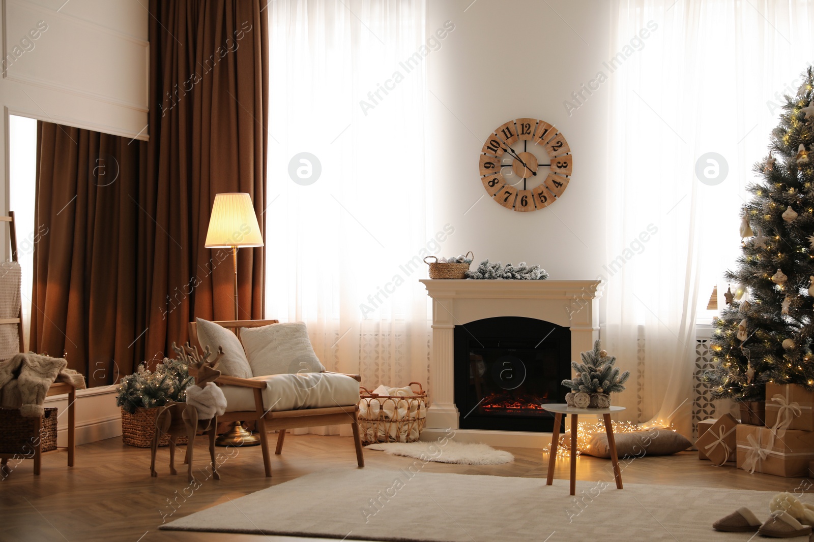 Photo of Beautiful living room interior with decorated Christmas tree and modern fireplace