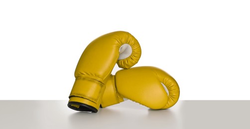 Image of Pair of yellow boxing gloves isolated on white