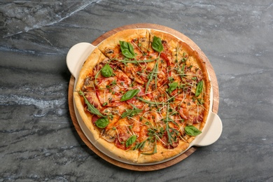 Photo of Tasty homemade pizza on table, top view