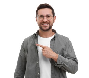 Photo of Special promotion. Smiling man pointing at something on white background