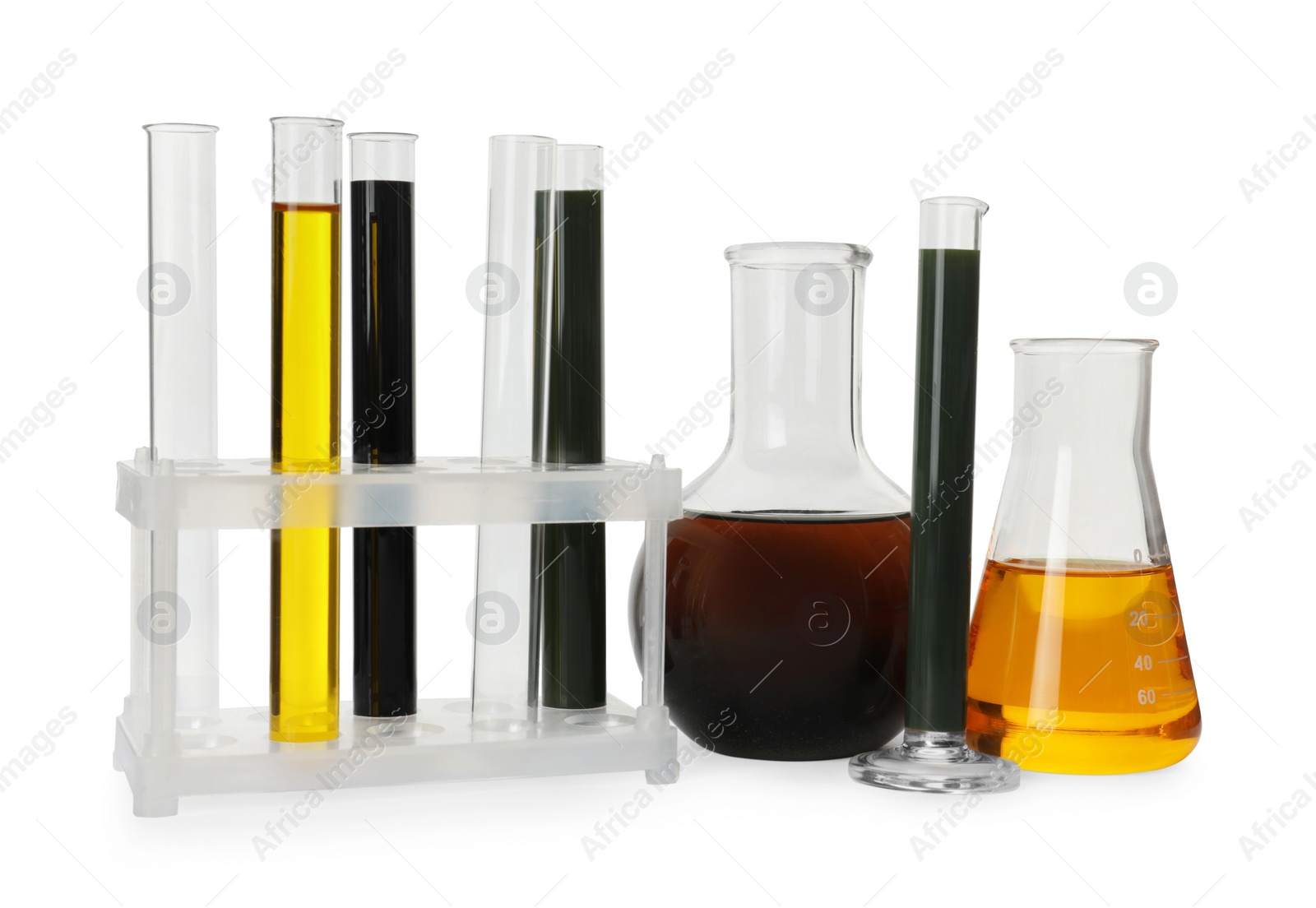 Photo of Laboratory glassware with different types of crude oil isolated on white