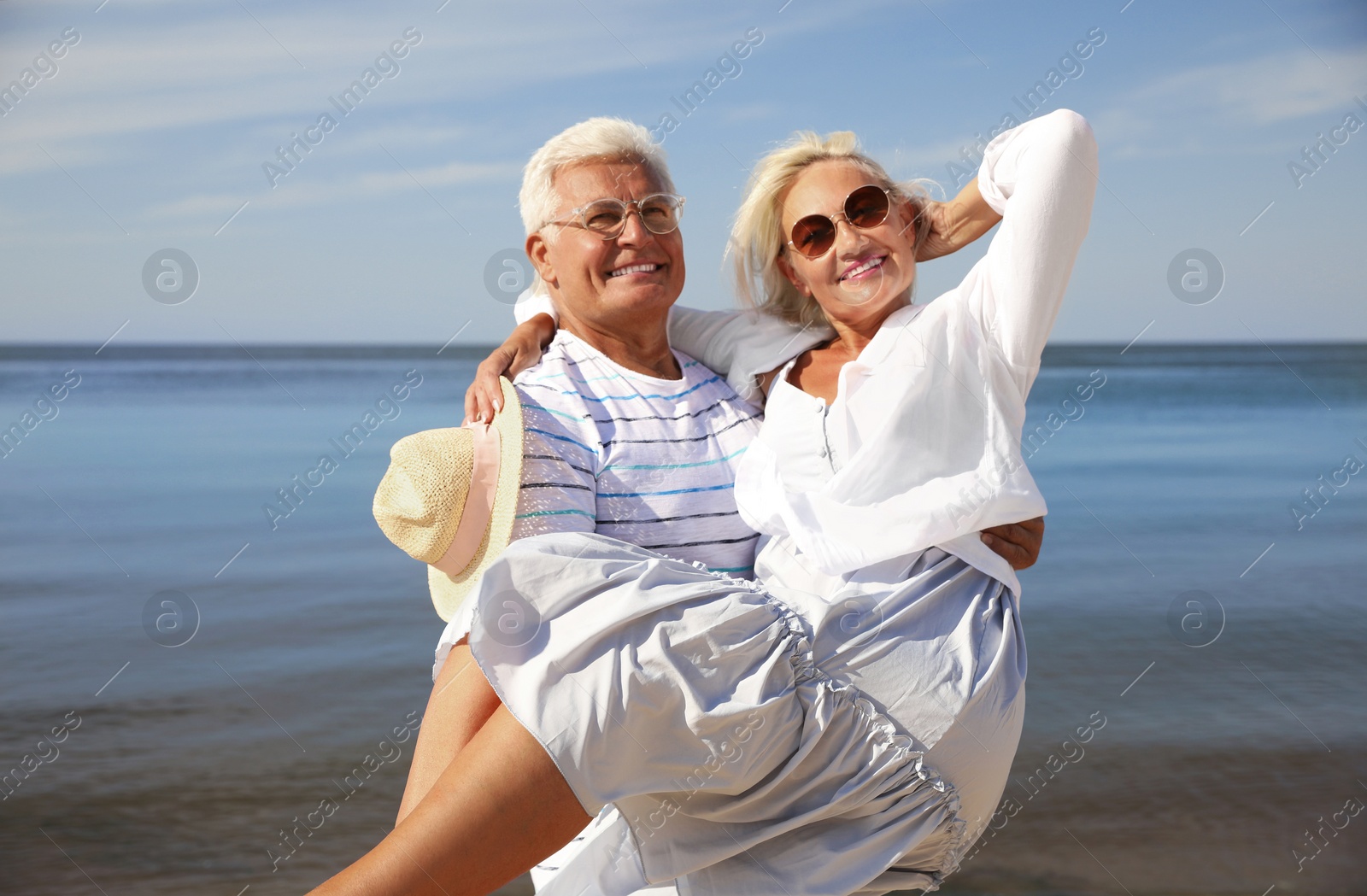 Photo of Mature couple spending time together near sea