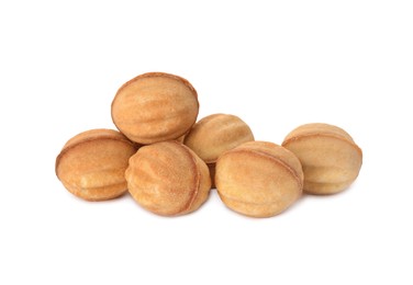 Photo of Delicious nut shaped cookies with condensed milk on white background