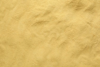 Granulated brewer`s yeast as background, top view