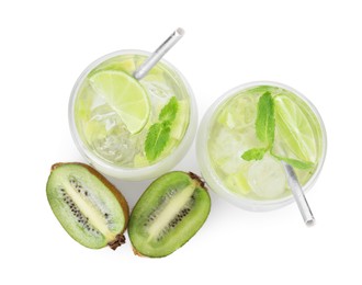 Photo of Glasses of refreshing drink and cut kiwi isolated on white, top view