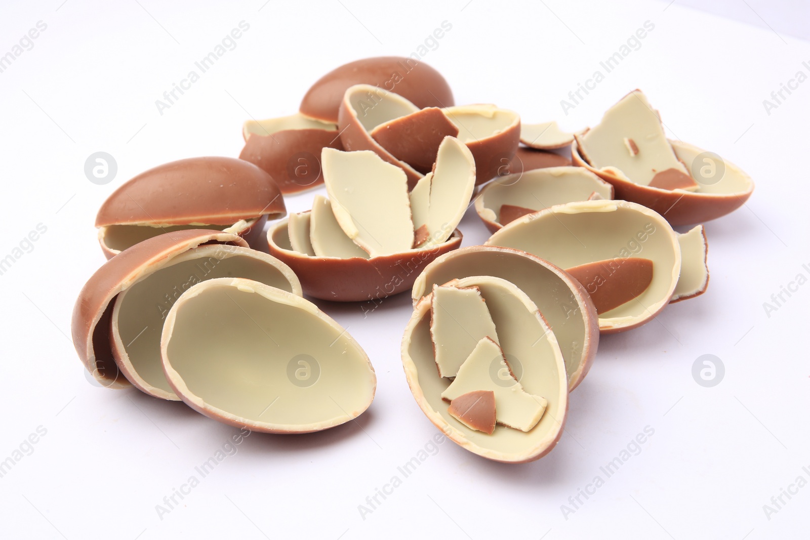 Photo of Sveti Vlas, Bulgaria - July 3, 2023: Broken halves of Kinder Surprise Eggs isolated on white