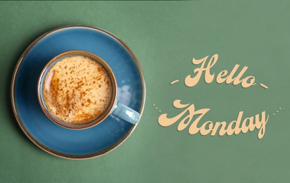 Image of Cup of hot aromatic coffee and phrase Hello Monday on color background, top view