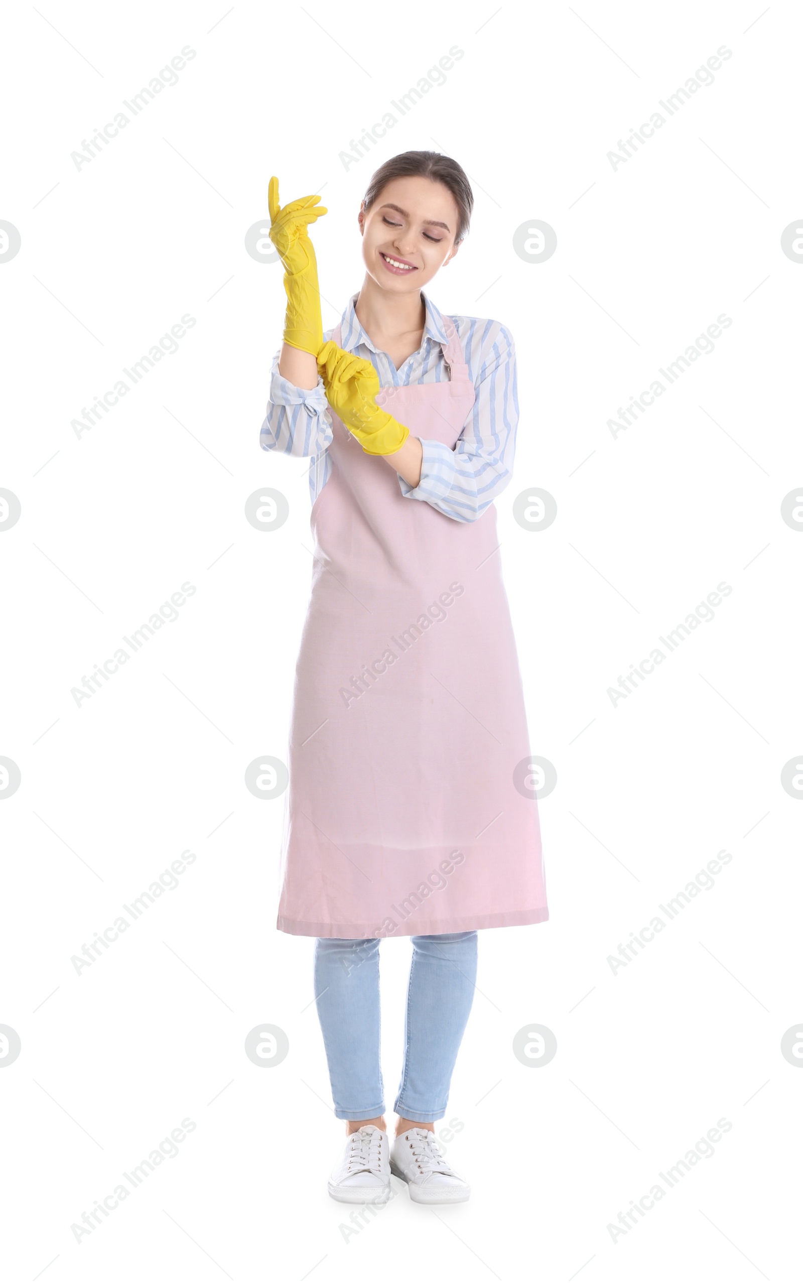 Photo of Young chambermaid wearing gloves on white background