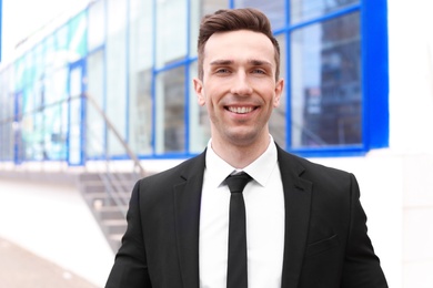 Photo of Male real estate agent outdoors