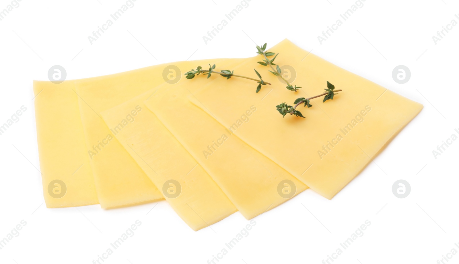 Photo of Slices of tasty fresh cheese and thyme isolated on white