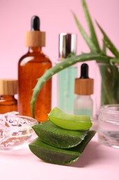 Photo of Natural cut aloe vera leaves on pink background